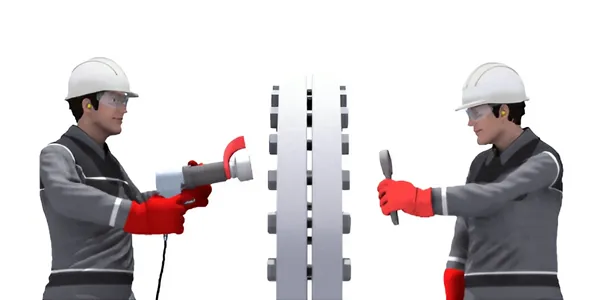 Two workers are operating a torque wrench Two workers are operating a torque wrench